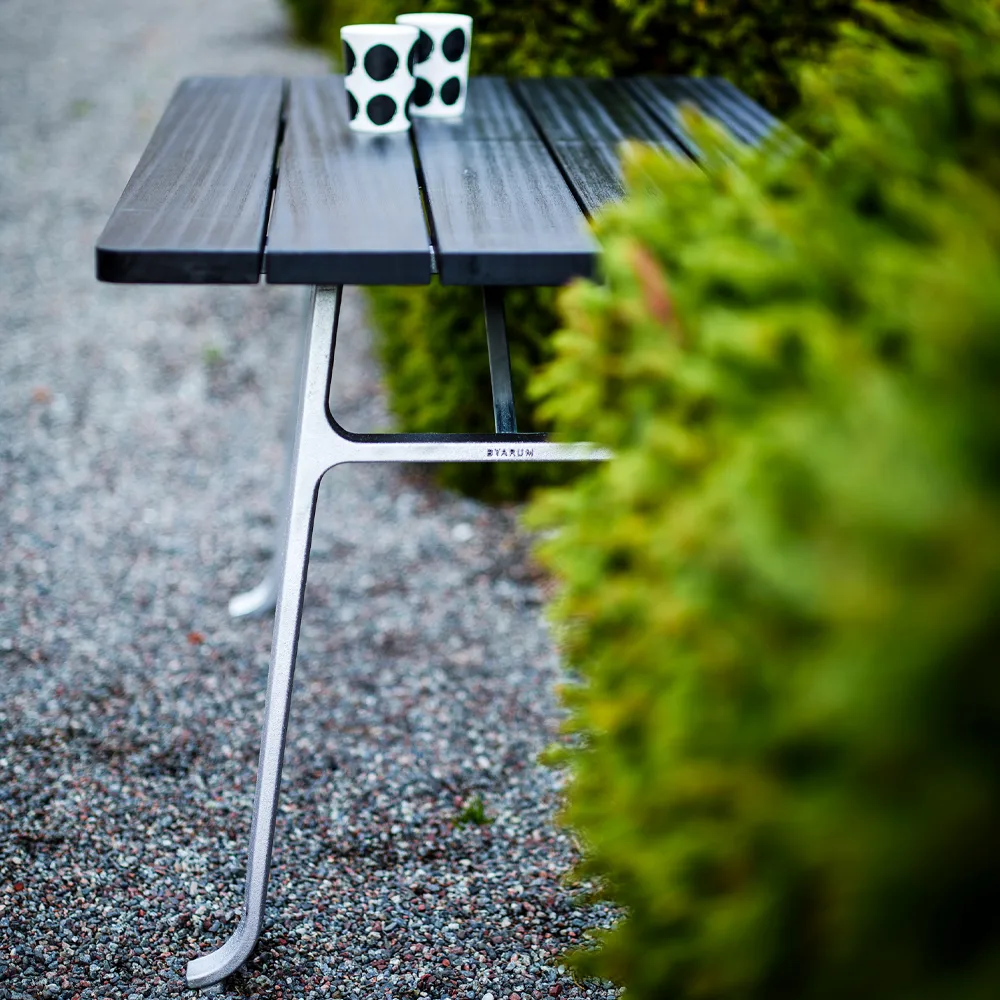 Seriff table, Mahogany black glaze, raw aluminum stand Byarums bruk
