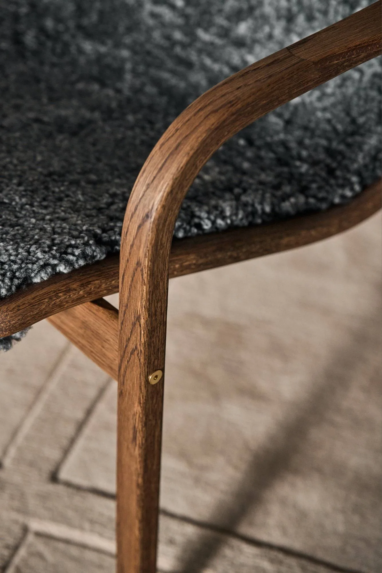 Lamino armchair and footstool, Sheepskin Charcoal-Rubio Monocoat Chocolate Swedese