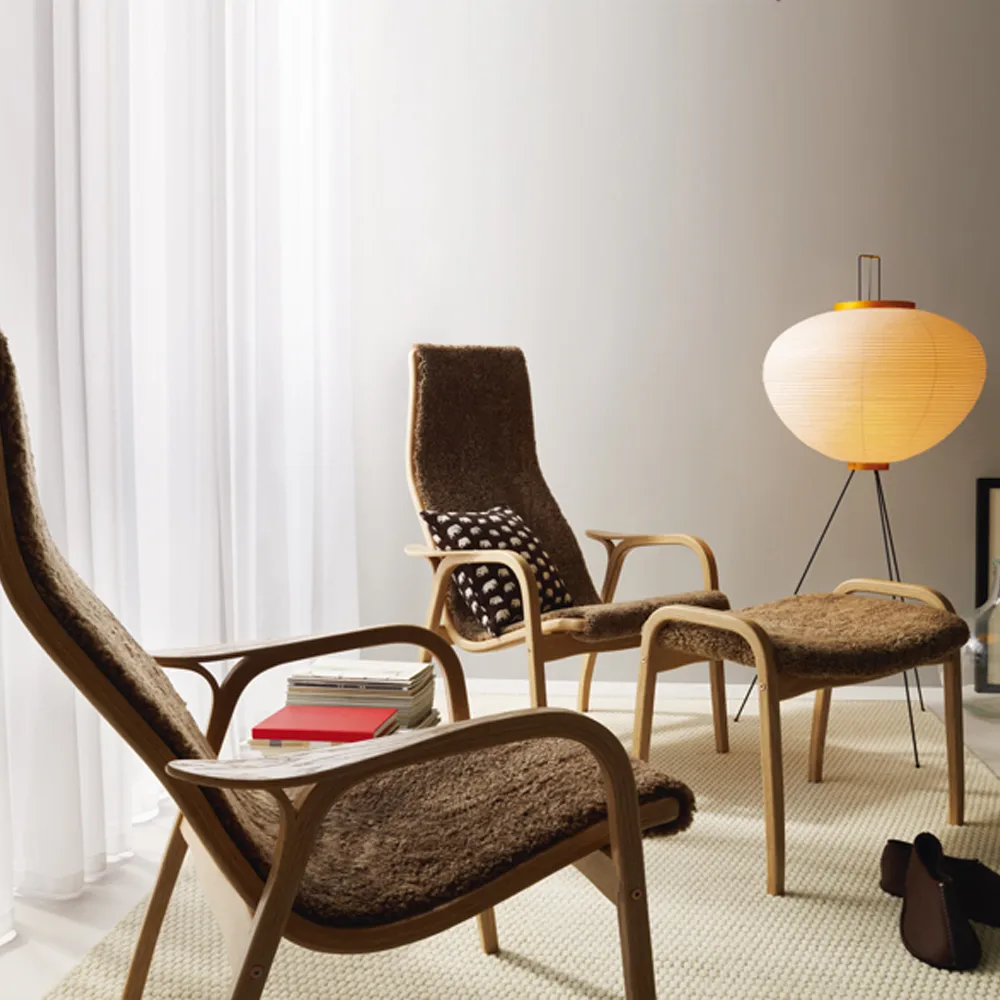 Lamino footstool, Sheepskin charcoal, natural lacquered walnut Swedese