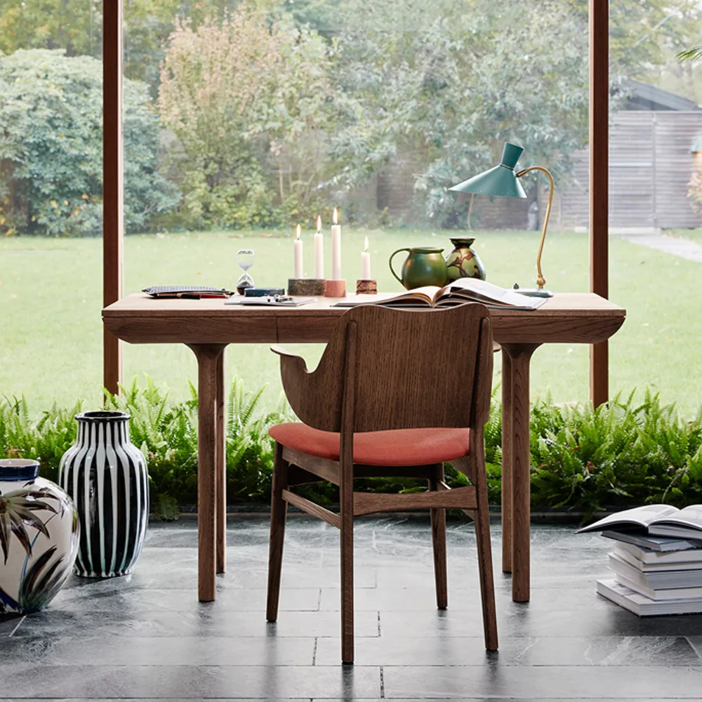 Gesture chair, upholstered seat and back, Fabric brick red, leather backrest, black lacquered beech legs Warm Nordic