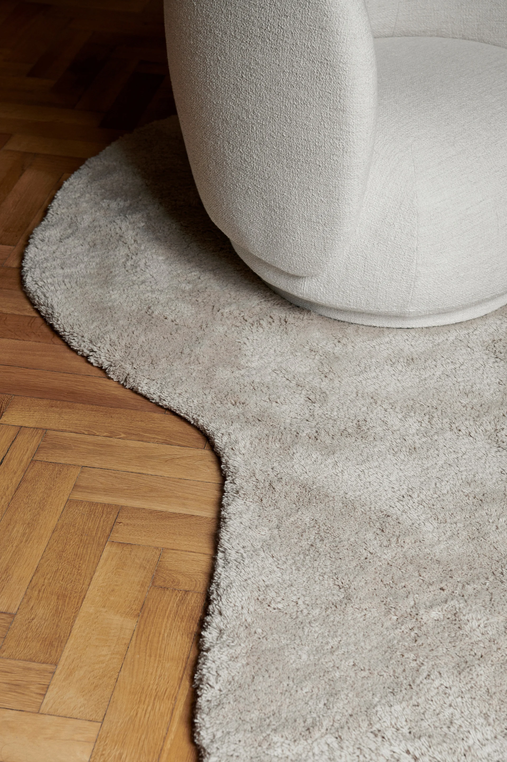 Flowing, tactile and organic design is one of the major Scandinavian interior design trends of 2024 and is represented here in the wavy rug from ferm Living.