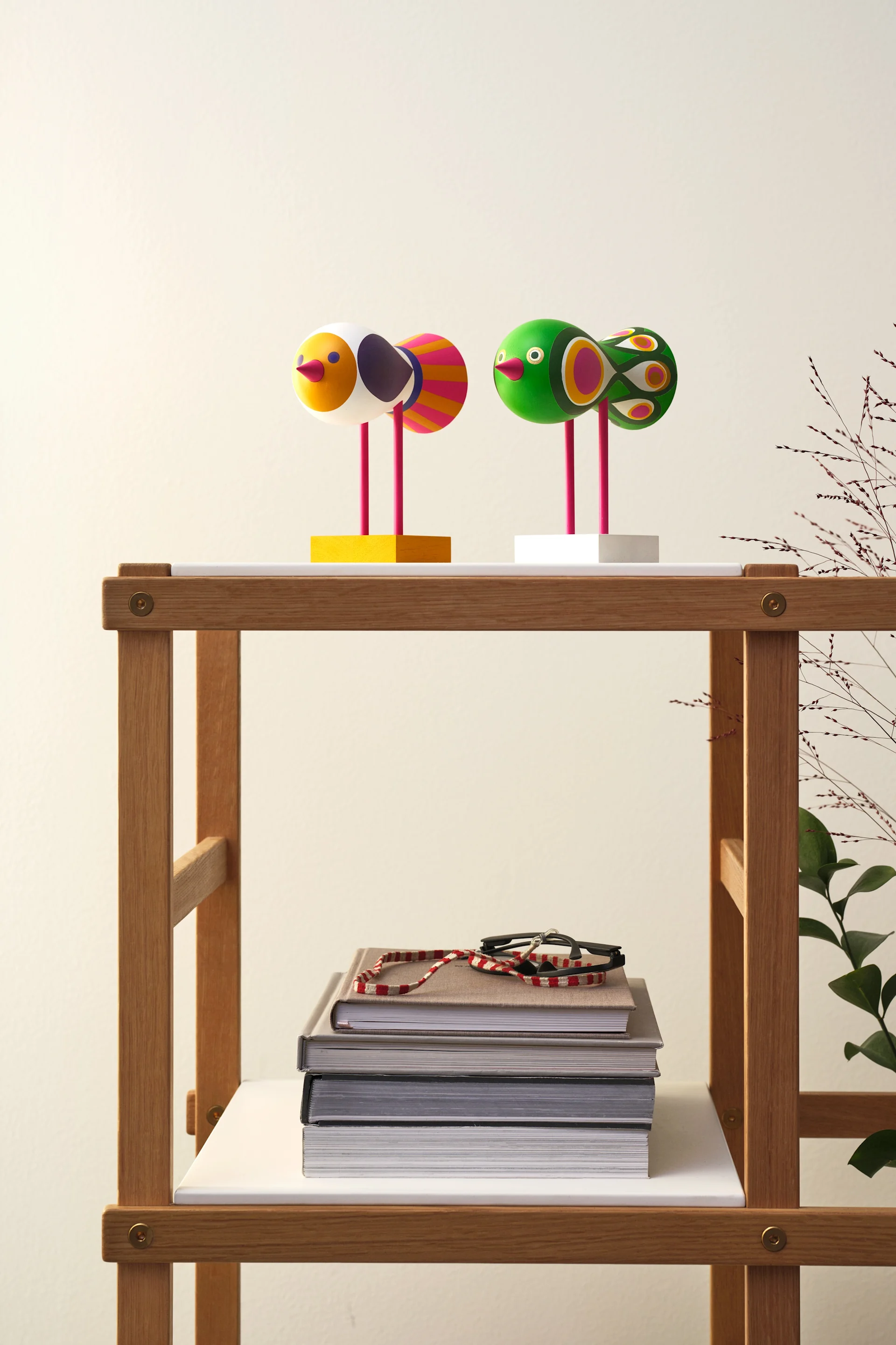 Two decorative birds on a side table showcasing one of 2026’s interior design trends.