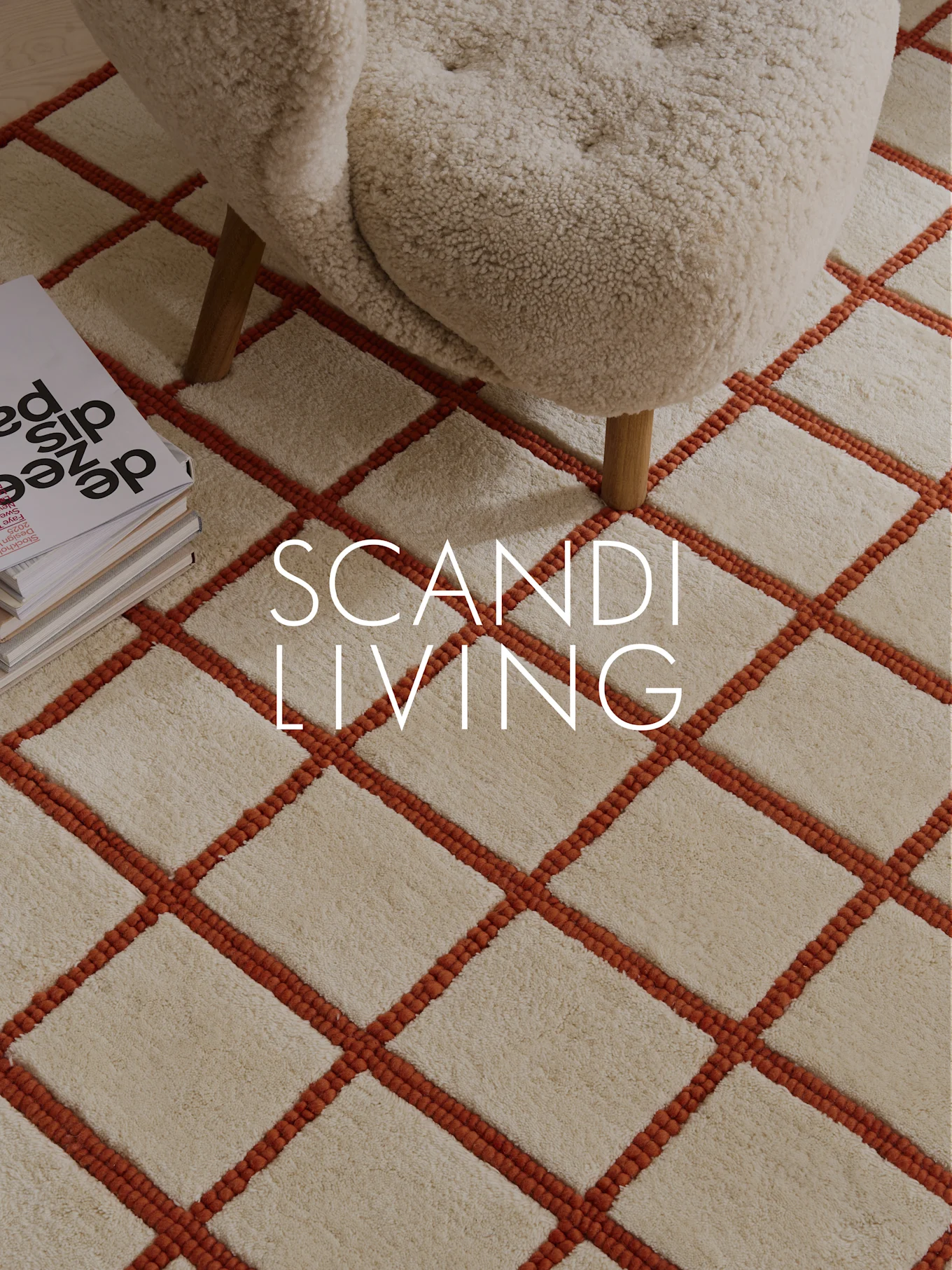 Cream shaggy rug with orange grid pattern, cream armchair, and books. Overlay text: SCANDI LIVING.